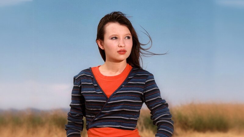 woman in striped sweater outdoors