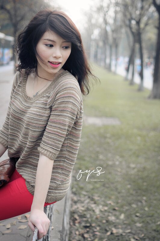 woman in striped sweater outdoors