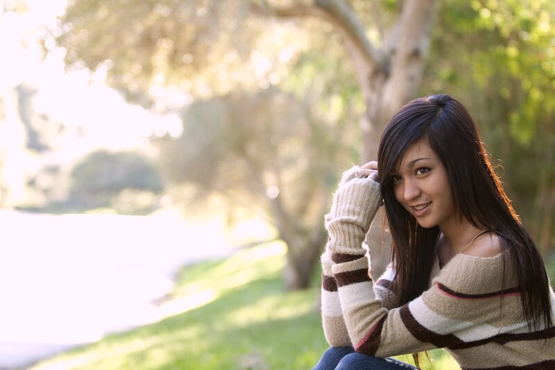 woman in striped sweater outdoors