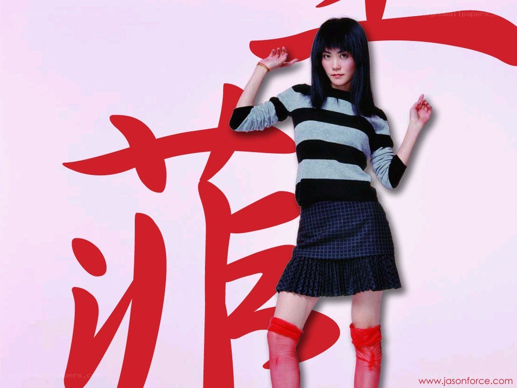 woman in striped sweater posing