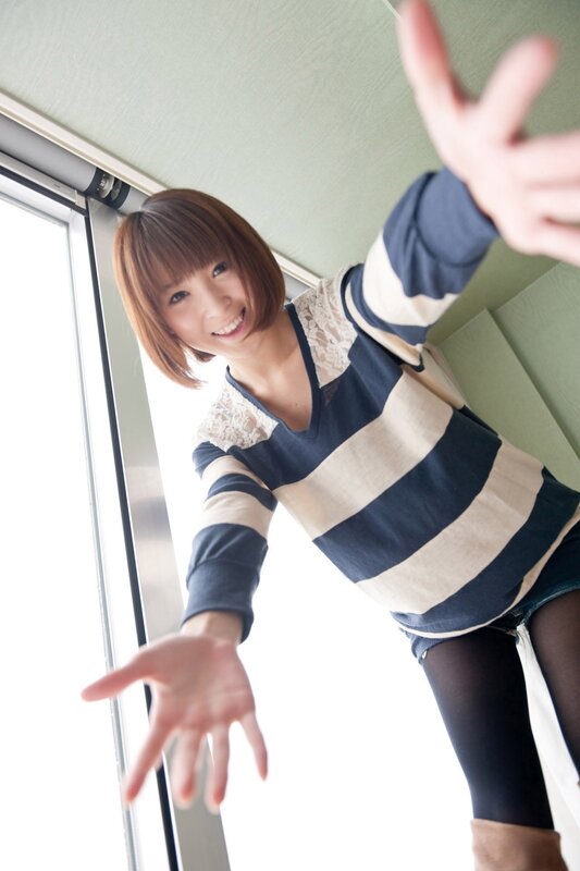 woman in striped sweater reaching out