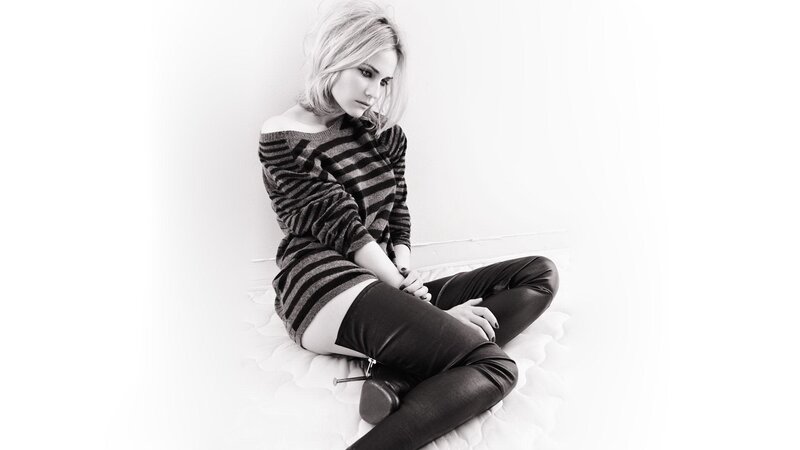 woman in striped sweater sitting
