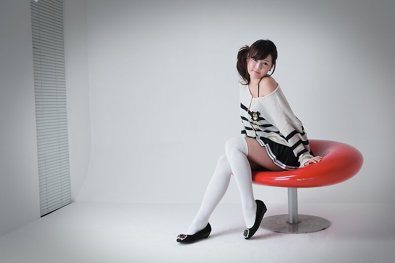 woman in striped sweater sitting