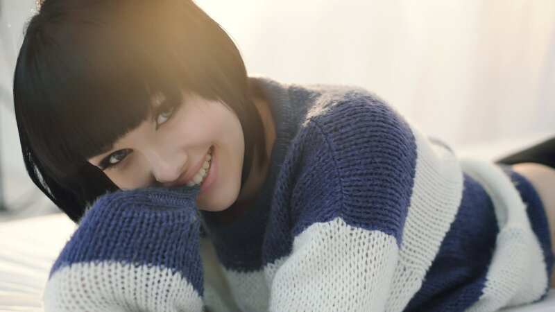 woman in striped sweater smiling