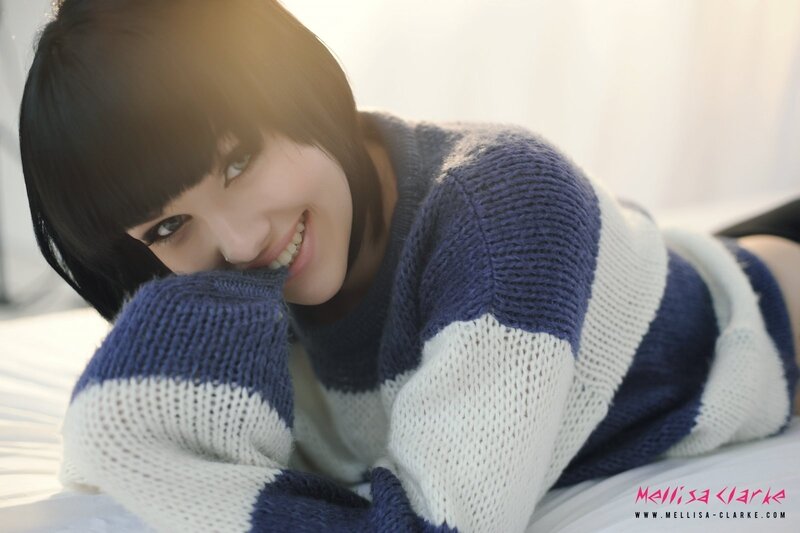 woman in striped sweater smiling