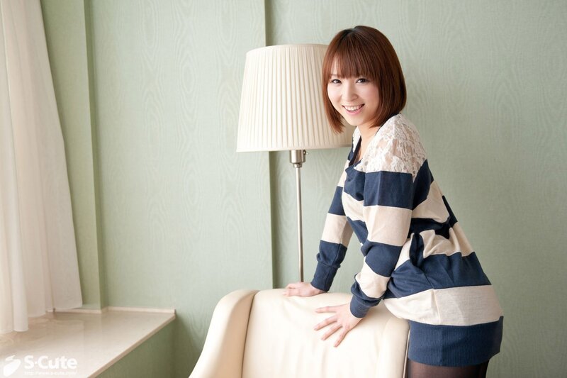woman in striped sweater smiling