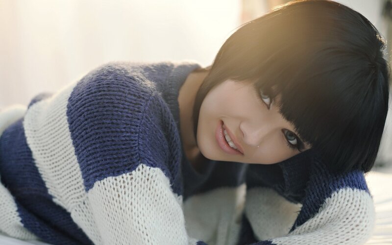 woman in striped sweater smiling