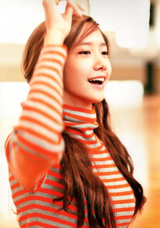 woman in striped sweater smiling