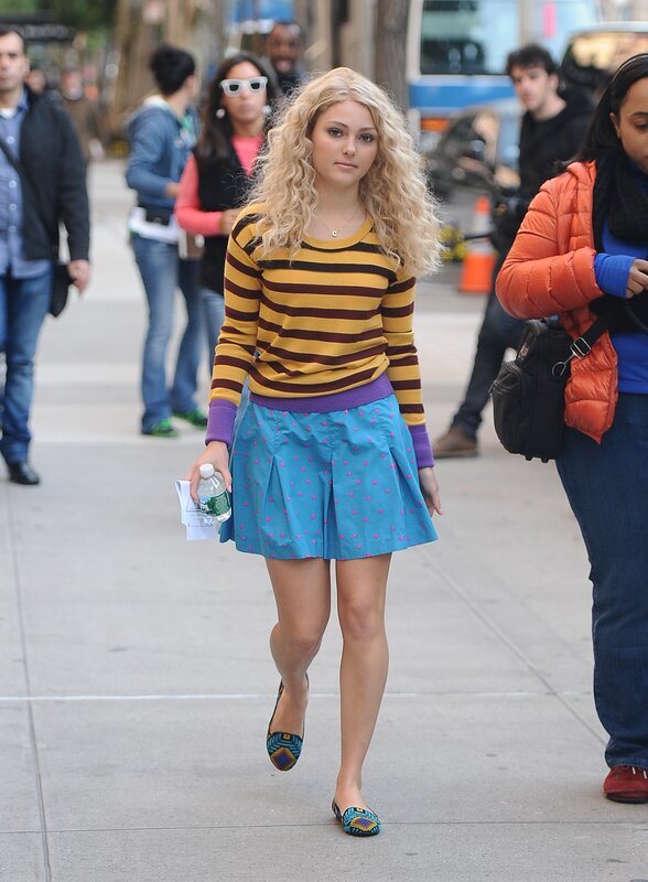 Woman in striped sweater walking
