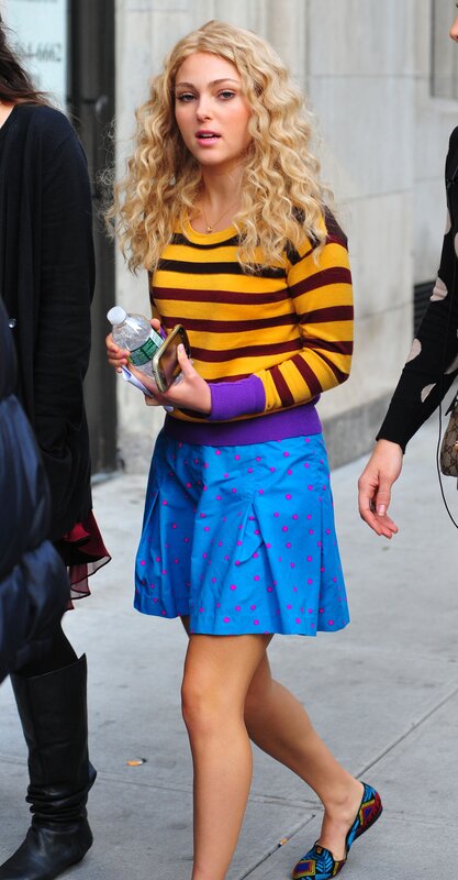 woman in striped sweater walking