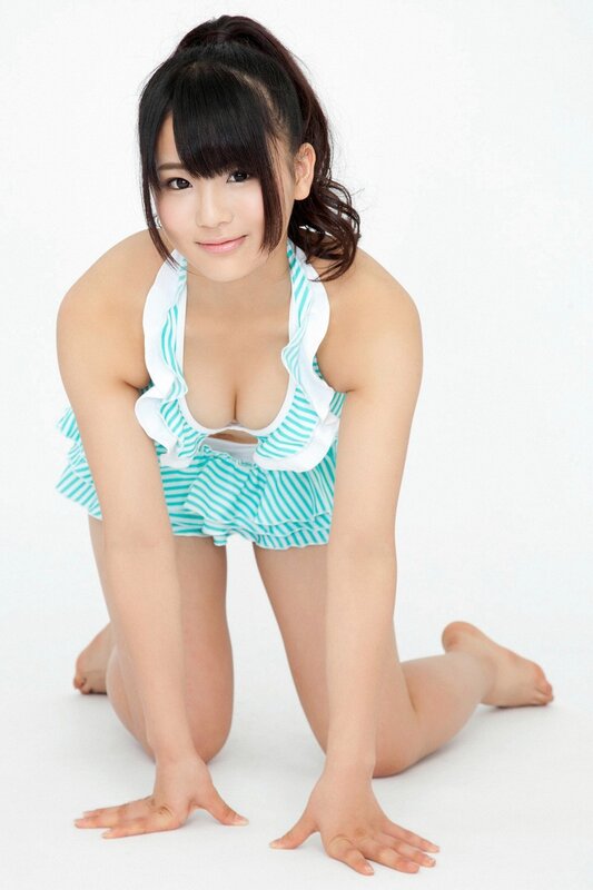 woman in striped swimsuit kneeling