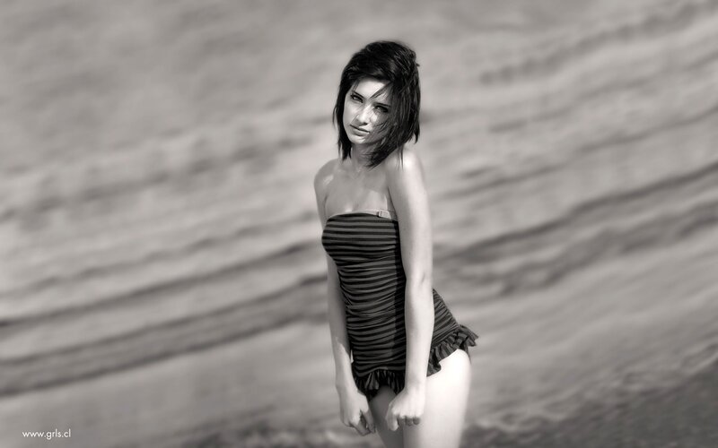 woman in striped swimsuit on beach