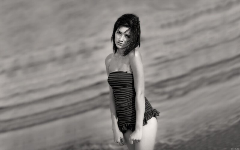 woman in striped swimsuit on beach