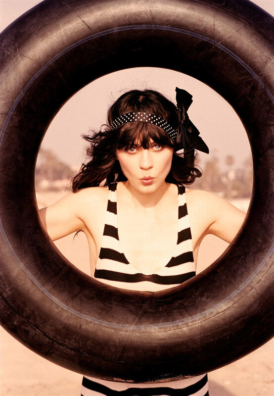 woman in striped swimsuit with tire