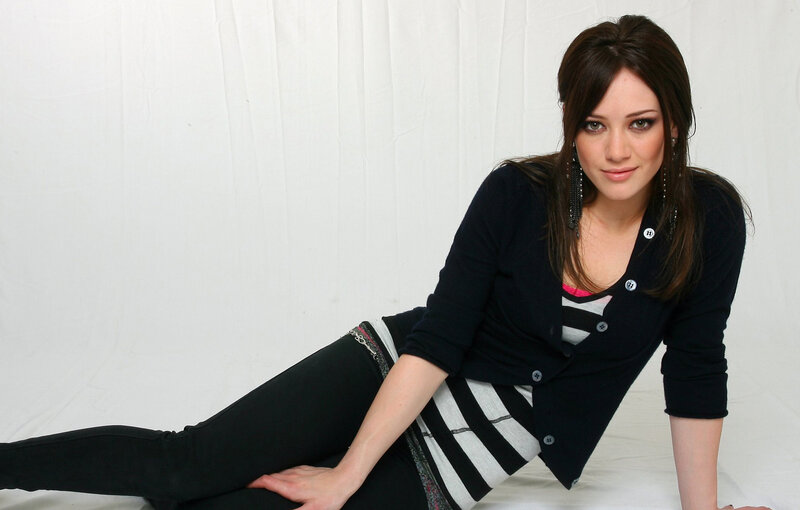 woman in striped top and cardigan