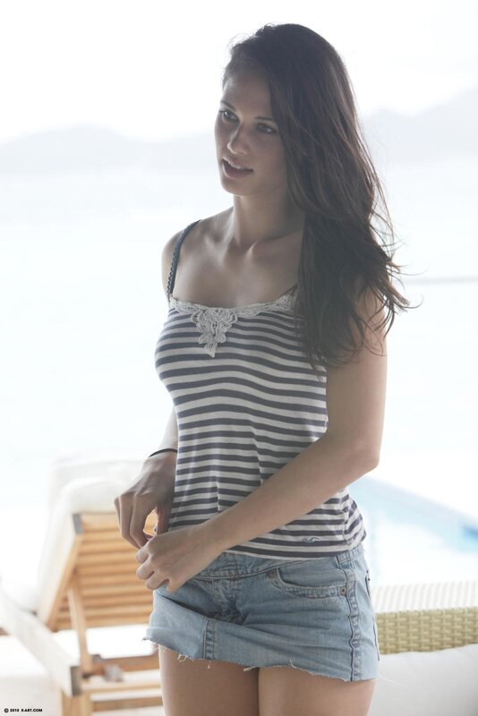 woman in striped top and denim shorts