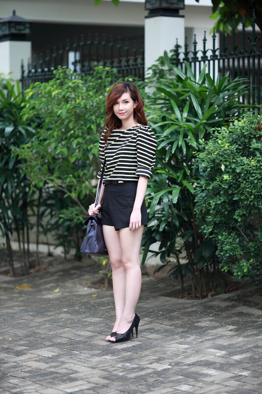 woman in striped top and shorts