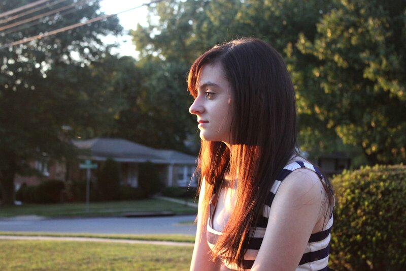 woman in striped top at sunset