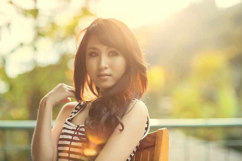 woman in striped top at sunset