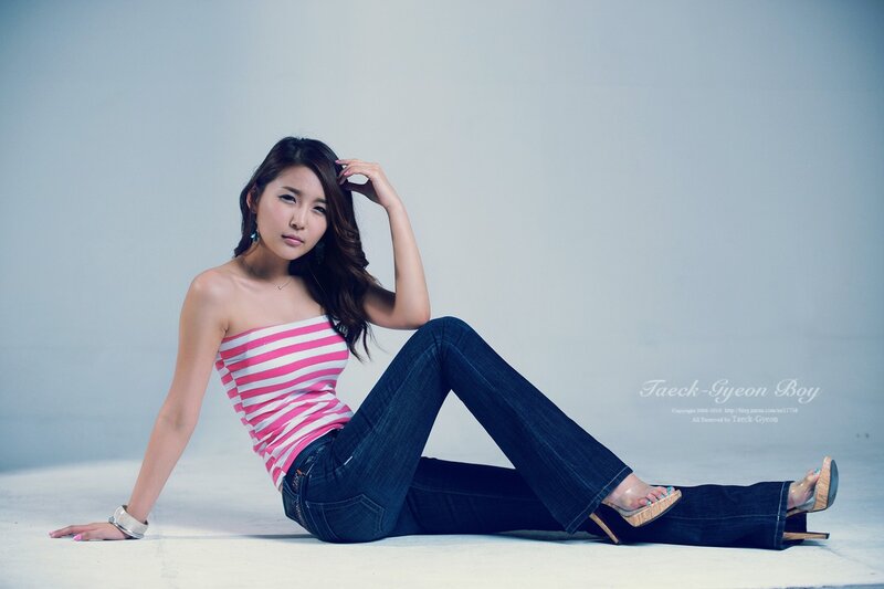 Woman in Striped Top — Blue, Neutral, Photograph, Jeans