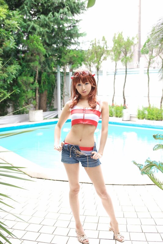 Woman in striped top by pool