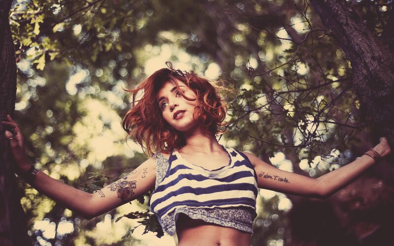 woman in striped top in forest