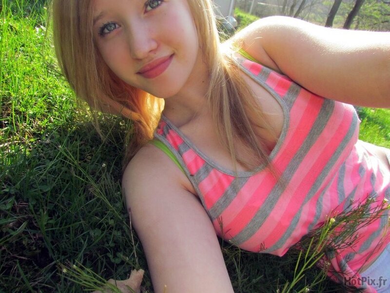 woman in striped top on grass