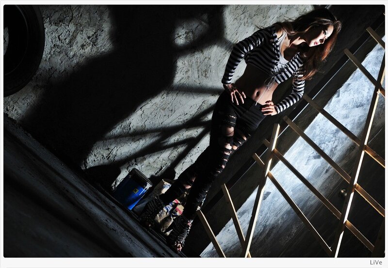 woman in striped top on ladder