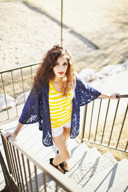 woman in striped top on stairs
