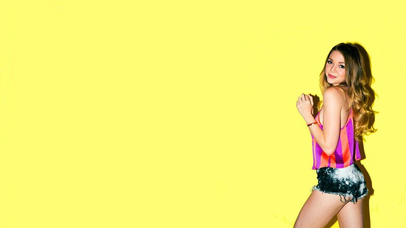woman in striped top on yellow