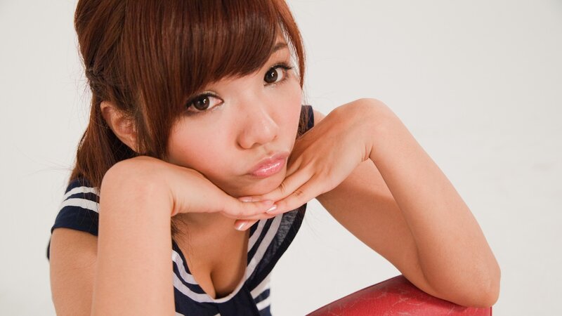 woman in striped top resting chin