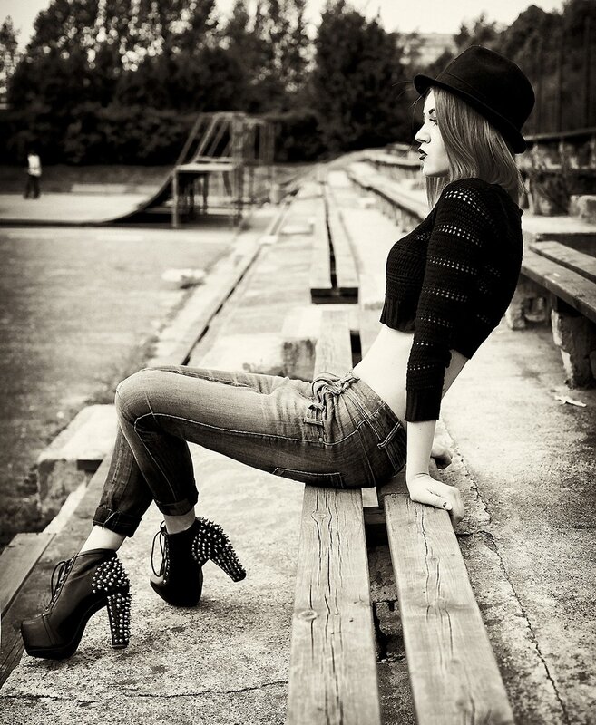 Woman in studded boots on bench