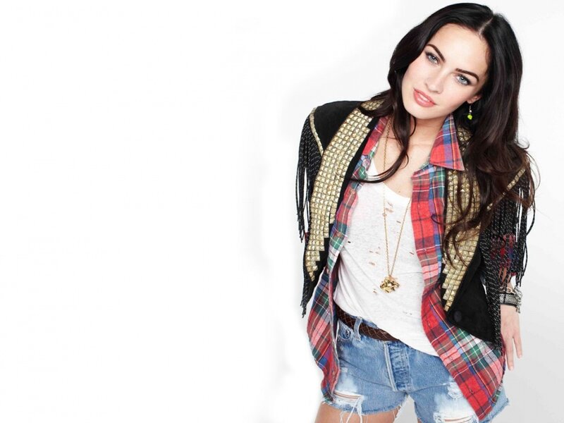 woman in studded vest and plaid shirt