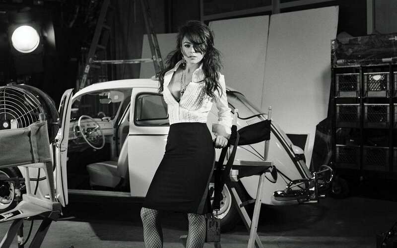 woman in studio with vintage car