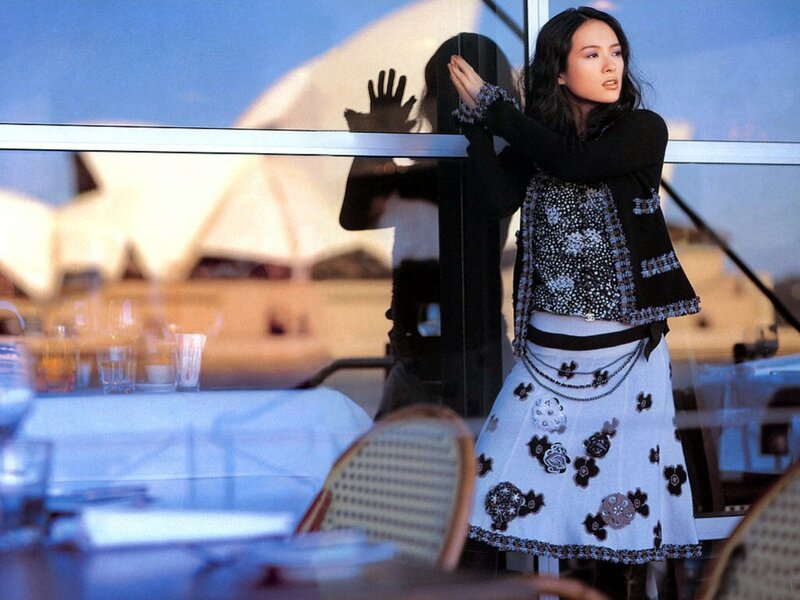 woman in stylish outfit by window