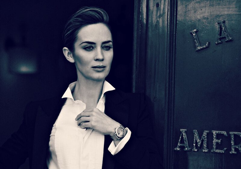 Woman in Suit Adjusting Shirt