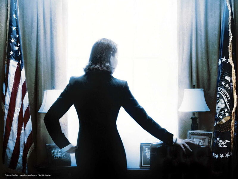 woman in suit by window