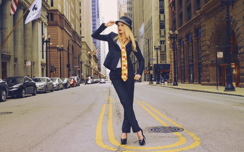 Woman in suit on city street