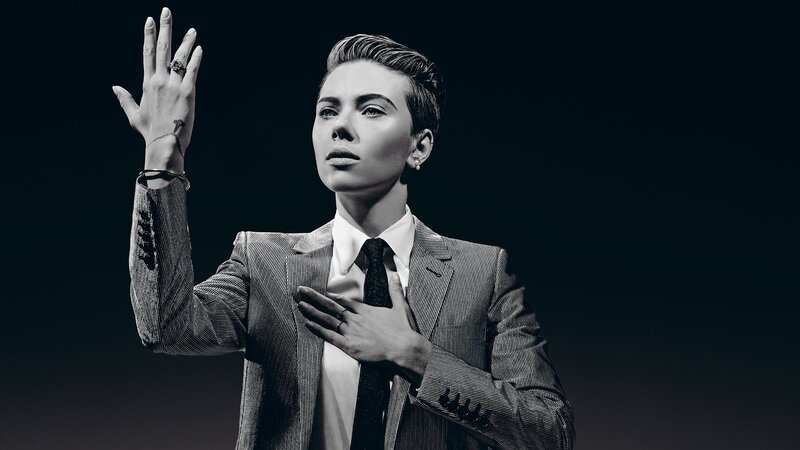 Woman in Suit Raising Hand