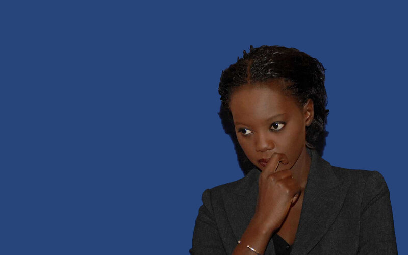 woman in suit thinking