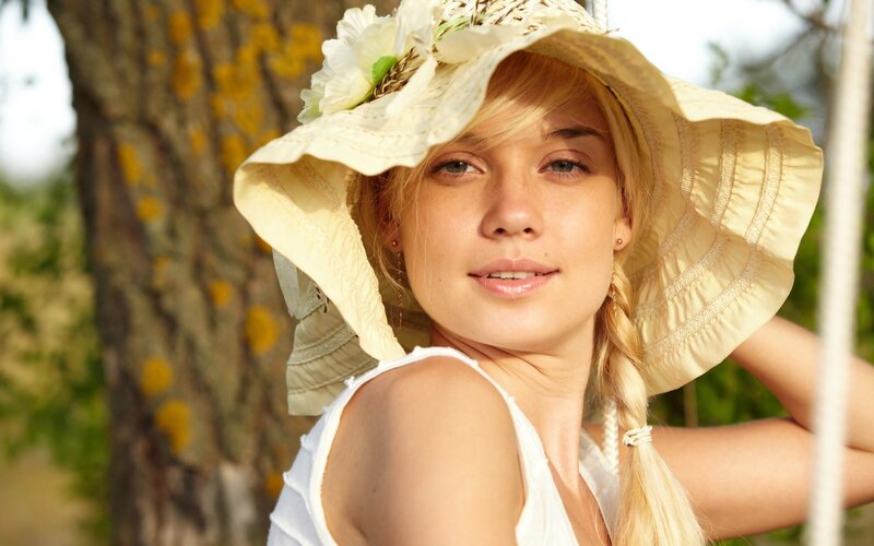 woman in sun hat outdoors