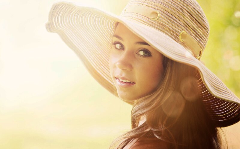 woman in sun hat outdoors