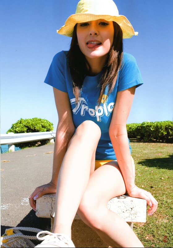 Woman in sun hat sitting outdoors