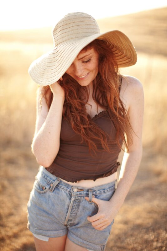 Woman in sun hat smiling