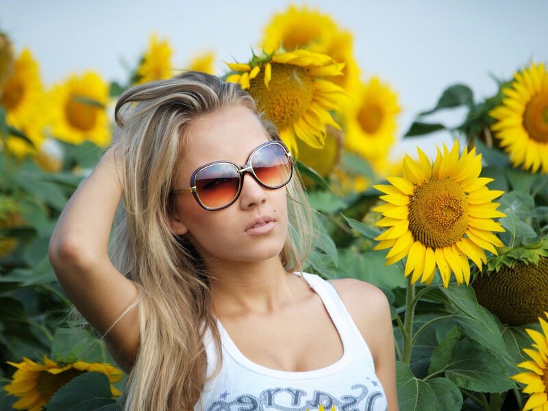 Woman in sunflower field