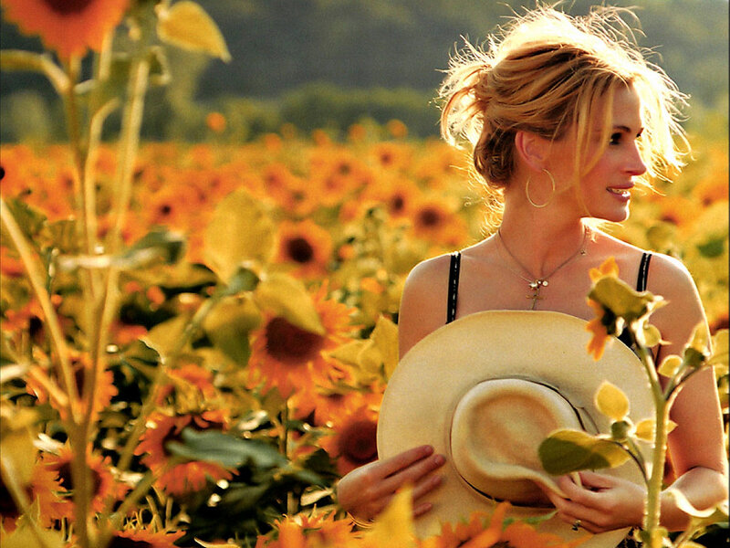 Woman in sunflower field