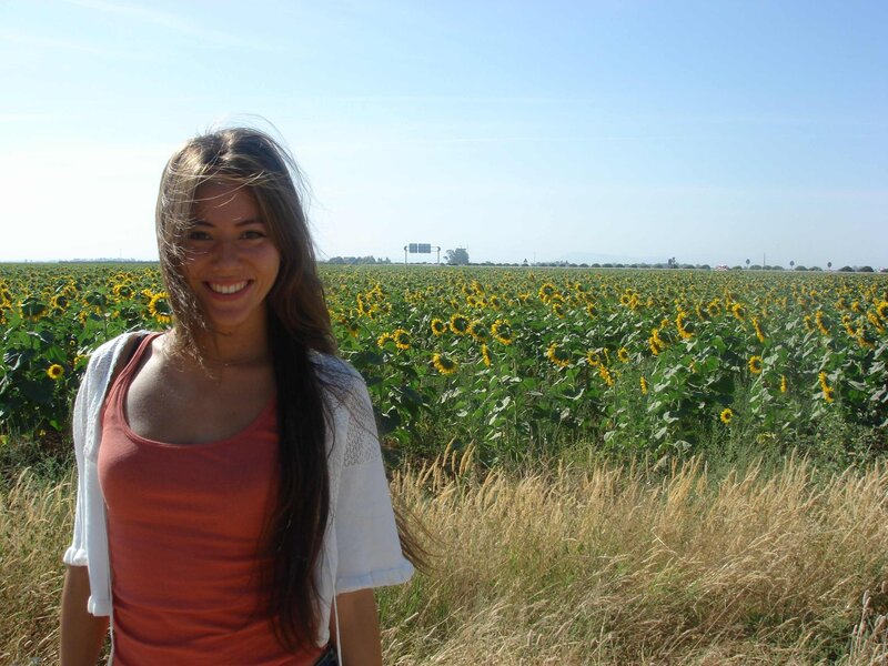 Woman in sunflower field