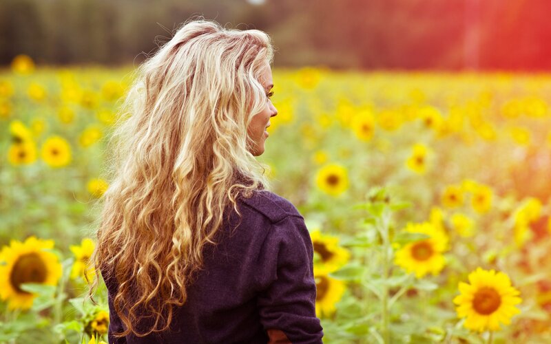 woman in sunflower field