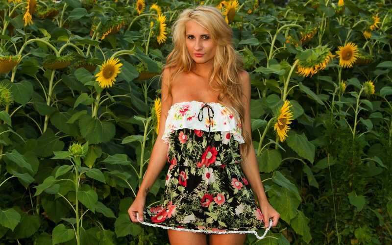 Woman in sunflower field