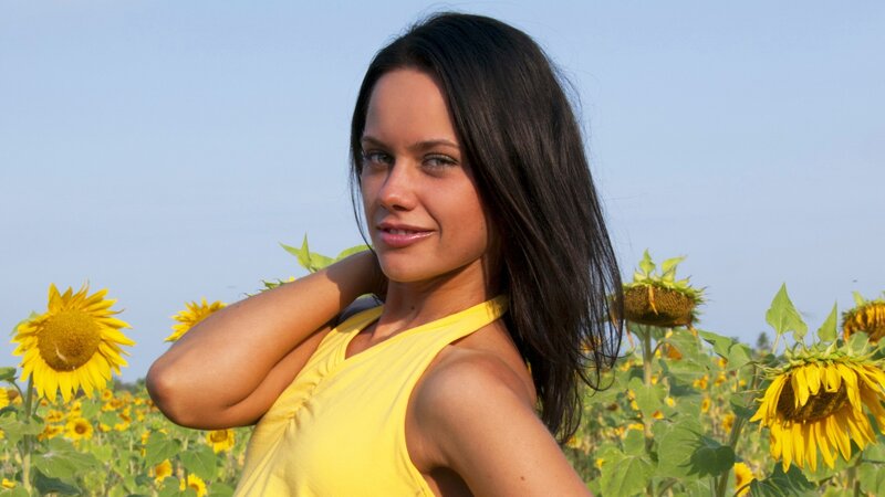 Woman in sunflower field